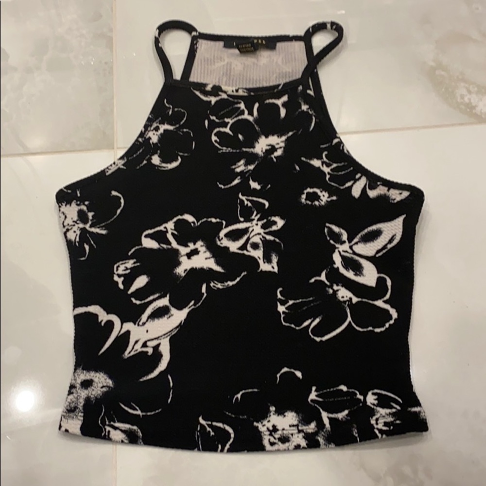 A black shirt with many white flowers
